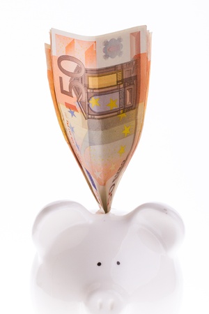 Saving fifty euro in a white money boxの写真素材