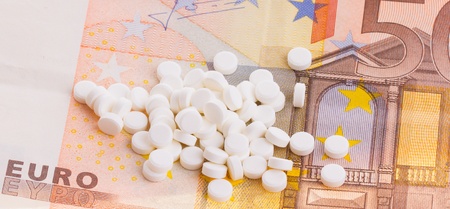 White pills on some 50 euro banknotesの写真素材