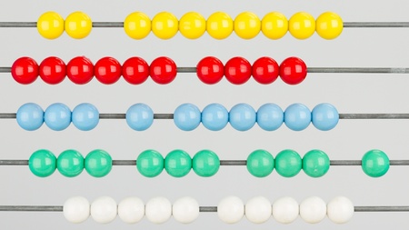 Close-up of an abacus on a white background