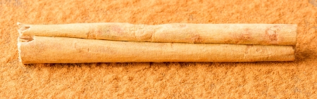 Cinnamon stick isolated on a wooden background (with cinnamon)の写真素材