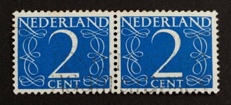THE NETHERLANDS - CIRCA 1950: Stamps printed in the Netherlands shows the number 2, circa 1950の写真素材