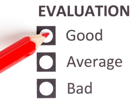 Red pencil on a evaluationform, choosing between excellent, very good and goodの写真素材