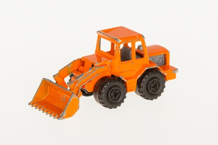 Very old car toy, 1970, orange bulldozerの写真素材