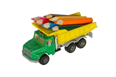 Very ol toy car (1970) with color pencils isolated on whiteの写真素材