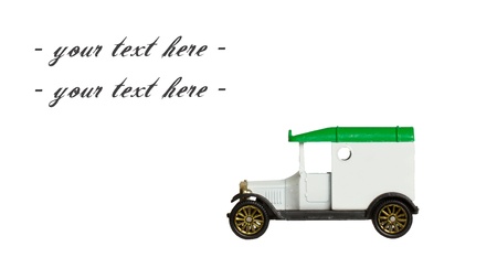 Old toy car (1920s car, 1970) isolated on whiteの写真素材