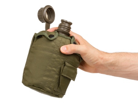 Man holding army water canteen isolated on a white backgroundの写真素材