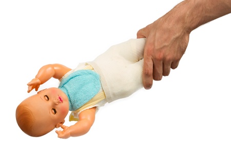 Very old baby doll (1940s), made with authentic clothing, isolatedの写真素材