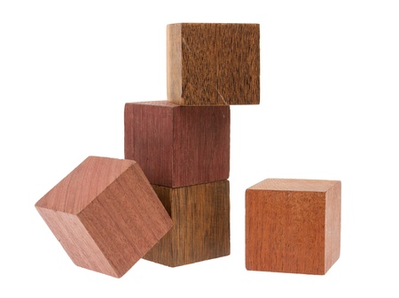 Several old cubes of wood, used by children for building (tropical wood)