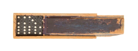 Very old domino in wooden box against the white background