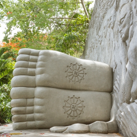 Feet of a sleeping buddha, decorated with a swastika, landmark on Nha Trang, Vietnamのeditorial素材