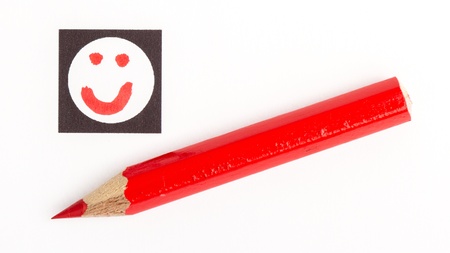 Red pencil choosing the right mood, like or unlike/dislike, isolatedの写真素材
