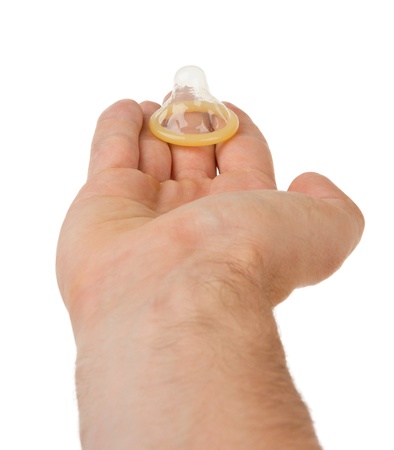Male giving a condom on a white backgroundの写真素材