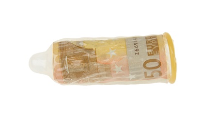 Money stuffed inside a condom depicting sex for money, isolated on whiteの写真素材