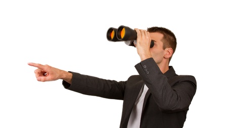 Portrait of a young male entrepreneur looking for business opportunities, isolatedの写真素材