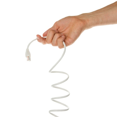 Young man keeping UTP cable, white background