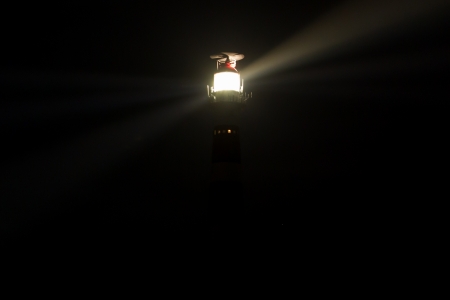 Lighthouse in the dark on the dutch isle of Ameland, Holland, room for textの写真素材