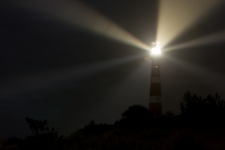 Lighthouse in the dark on the dutch isle of Ameland, Holland, room for textの写真素材