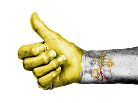 Old woman with arthritis giving the thumbs up sign, wrapped in flag pattern, Vaticanの写真素材