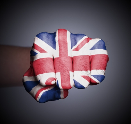Front view of punching fist on gray background, flag of the UKの写真素材