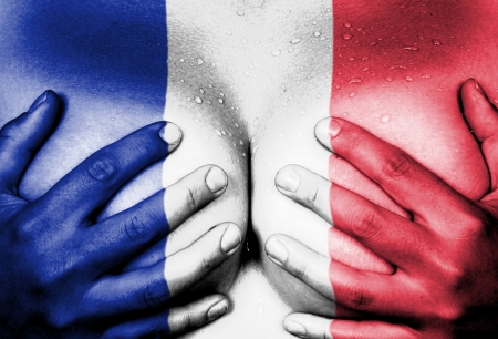 Sweaty upper part of female body, hands covering breasts, flag of Franceの写真素材
