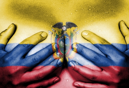 Sweaty upper part of female body, hands covering breasts, flag of Ecuadorの写真素材