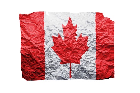 Close up of a curled paper on white background, print of the flag of Canada