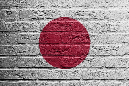 Brick wall with a painting of a flag isolated, Japanの写真素材
