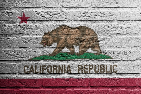 Brick wall with a painting of a flag isolated, Californiaの写真素材