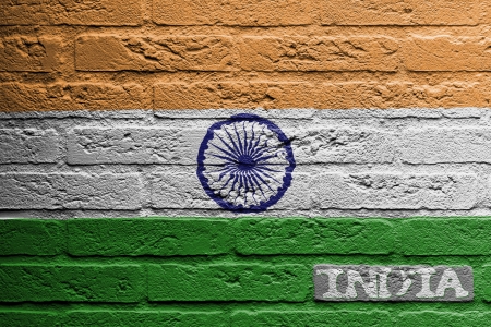 Brick wall with a painting of a flag isolated, Indiaの写真素材