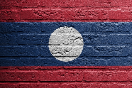 Brick wall with a painting of a flag isolated, Laosの写真素材