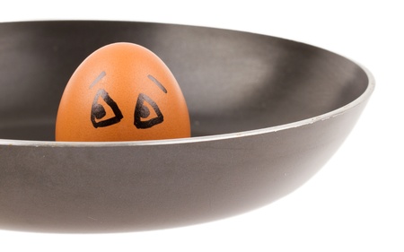Scared egg, waiting to be fried in a pan, isolated