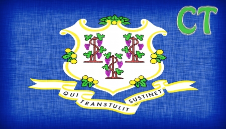 Linen flag of the US state of Connecticut with it's abbreviation stitched on itの写真素材