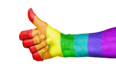 Old woman with arthritis giving the thumbs up sign, rainbow flag patternの写真素材
