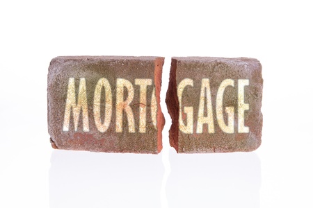 Broken brick isolated on a white background, mortgageの写真素材