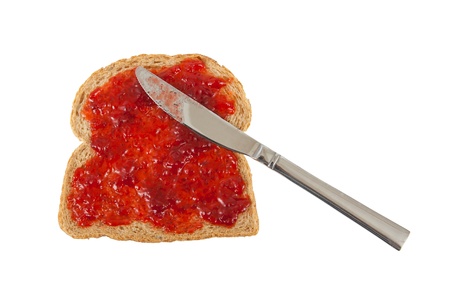 Slice of brown bread with jam isolated on whiteの写真素材