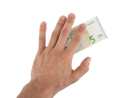 Male hand holding a new 5 Euro bills, isolated on whiteの写真素材