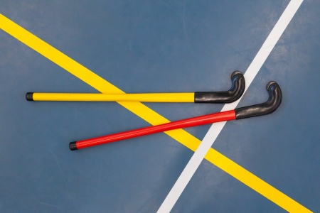 Hockeysticks in an old school gym, Holland