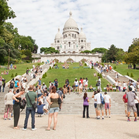 PARIS, FRANCE - JULY 28: Sacre Coeur Basilica in summer day. Large medieval cathedral. Basilica of Sacred Heart. Popular landmark, highest city point. のeditorial素材