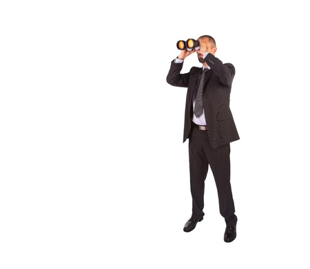 Portrait of a young male entrepreneur looking for business opportunities, isolatedの写真素材