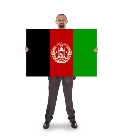 Businessman holding a big card, flag of Afghanistan, isolated on whiteの写真素材