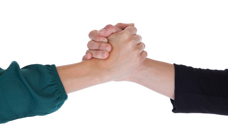 Close up of two women shaking hands, isolated on whiteの写真素材