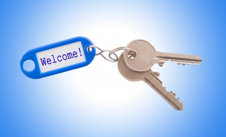 Key with blank label isolated on white background, welcome