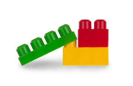 Colorful plastic bricks isolated on white 