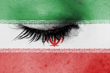 Crying woman, pain and grief concept, flag of Iranの写真素材