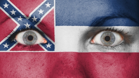 Close up of eyes. Painted face with flag of Mississippiの写真素材