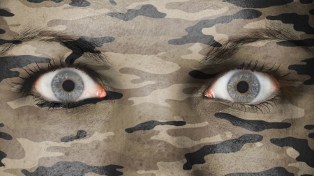 Close up of eyes. Painted face with camouflageの写真素材