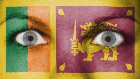 Close up of eyes. Painted face with flag of Sri Lankaの写真素材