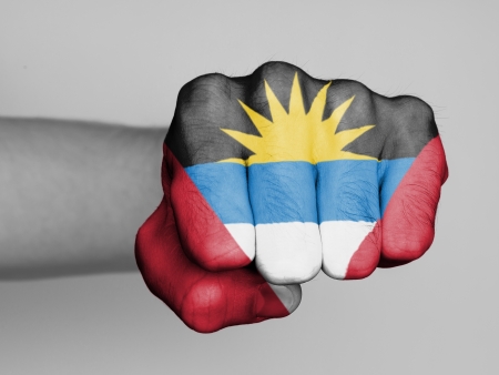 Fist of a man punching, flag of ANtigua and Barbudaの写真素材