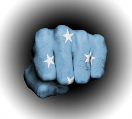 Fist of a man punching, flag of Micronesiaの写真素材