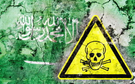Old cracked wall with poison warning sign and painted flag, flag of Saudi Arabiaの写真素材